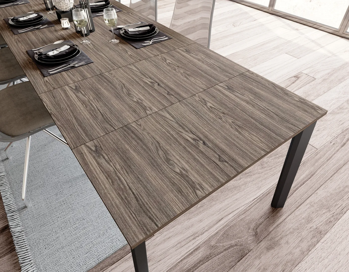 Table à manger extensible en bois foncé avec pieds en métal noir, aménagement de salle à manger moderne.