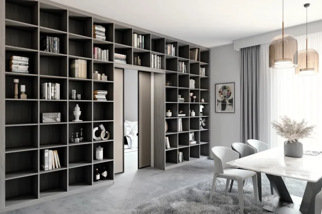 Grande bibliothèque de salle à manger : Bibliothèque monumentale noire occupant tout un mur dans une pièce de vie spacieuse avec table à manger blanche.