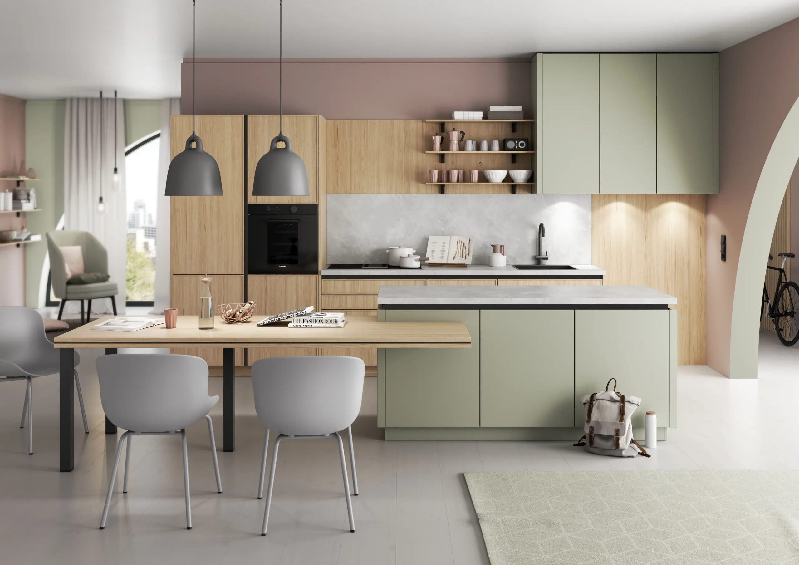 Cuisine ouverte de style scandinave avec des meubles vert sauge et bois clair, un îlot de cuisine avec table à manger intégrée et des chaises grises.
